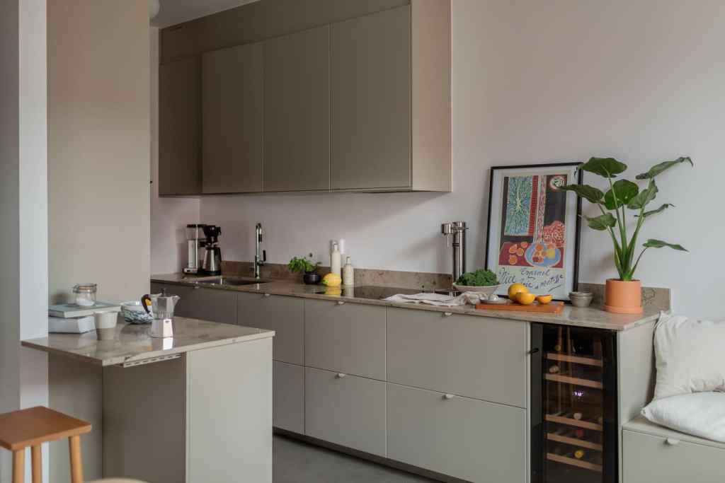 A minimal galley kitchen with a seating nook