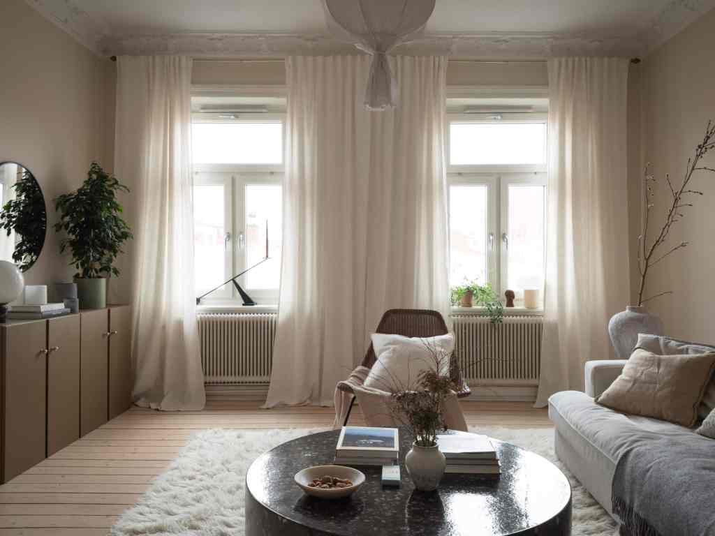 A cream living room with a painted Ikea Ivar cabinet