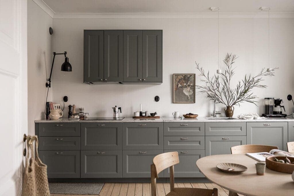 A one-wall kitchen layout with grey cabinets