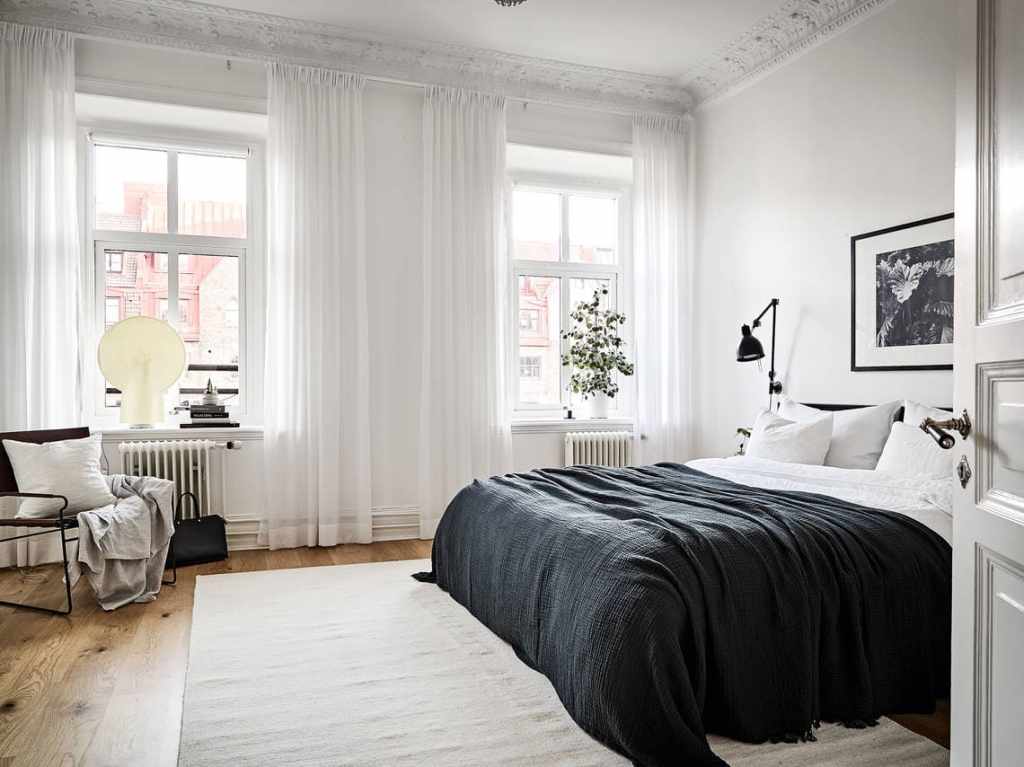 A black and white bedroom color palette in a turn-of-the-century apartment