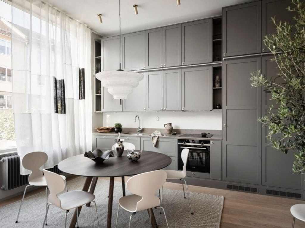 A one-wall kitchen layout with dark grey kitchen cabinets
